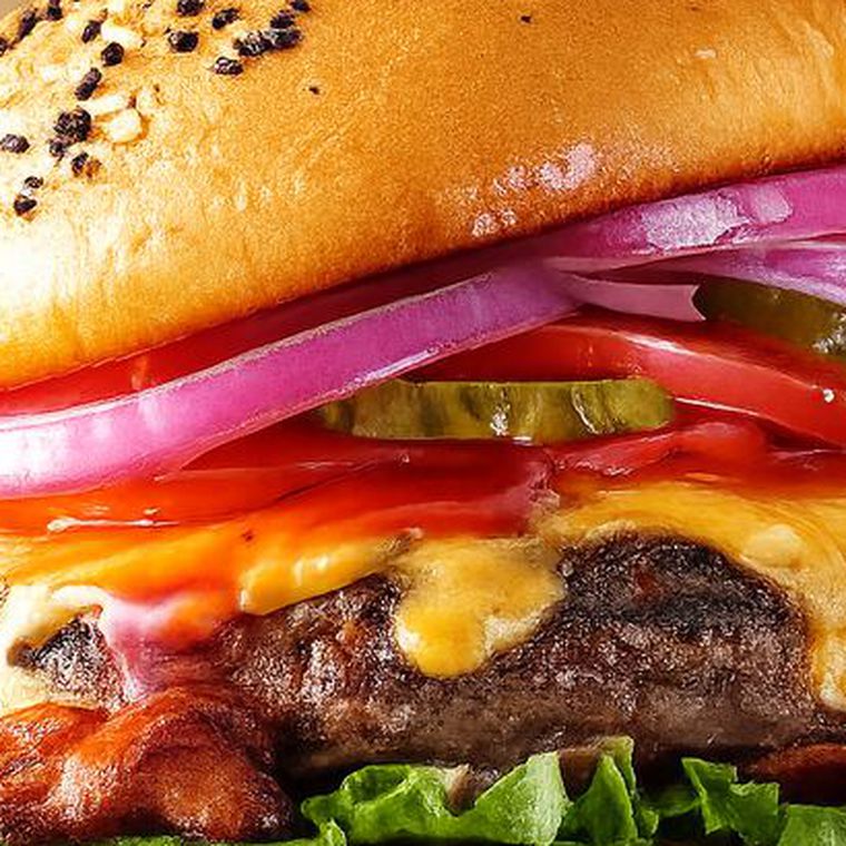 Cheeseburger with bacon, lettuce, tomato and red onion