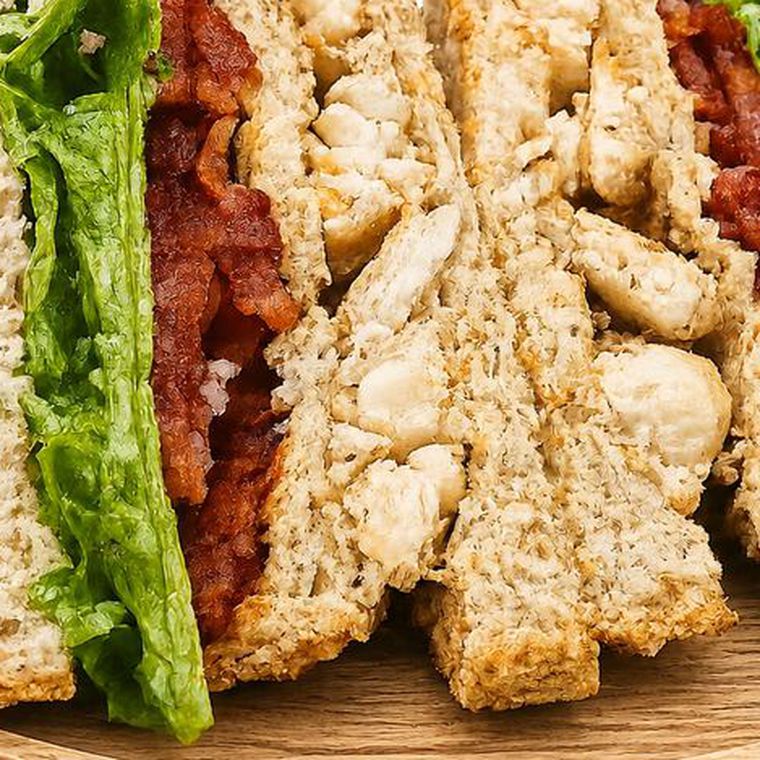 Three-layer clubhouse sandwich with chicken, bacon and lettuce