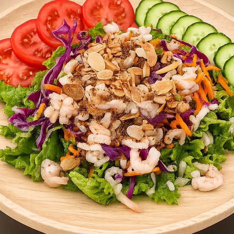 Shrimp salad with toasted almonds, red cabbage, carrot, cucumber and tomato